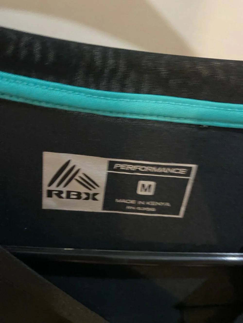 Reebok Black Long-Sleeve Performance Shirt with Teal Accents - Picture 2 of 2